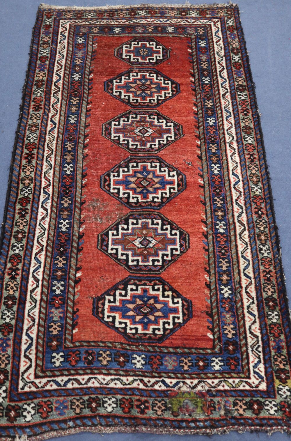 A blue Kurdish rug, 204 x 106cm